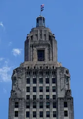 The tower of the Louisiana State Capitol against a blue sky